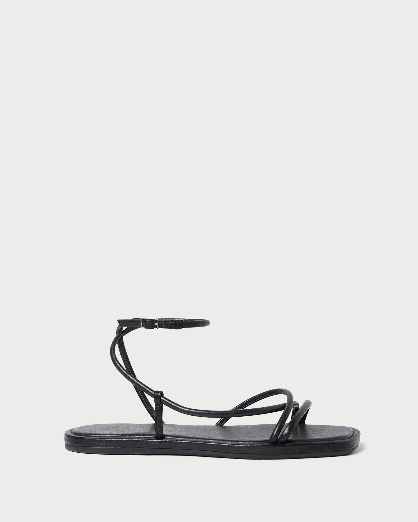 Sandale plate en cuir noir Noor
