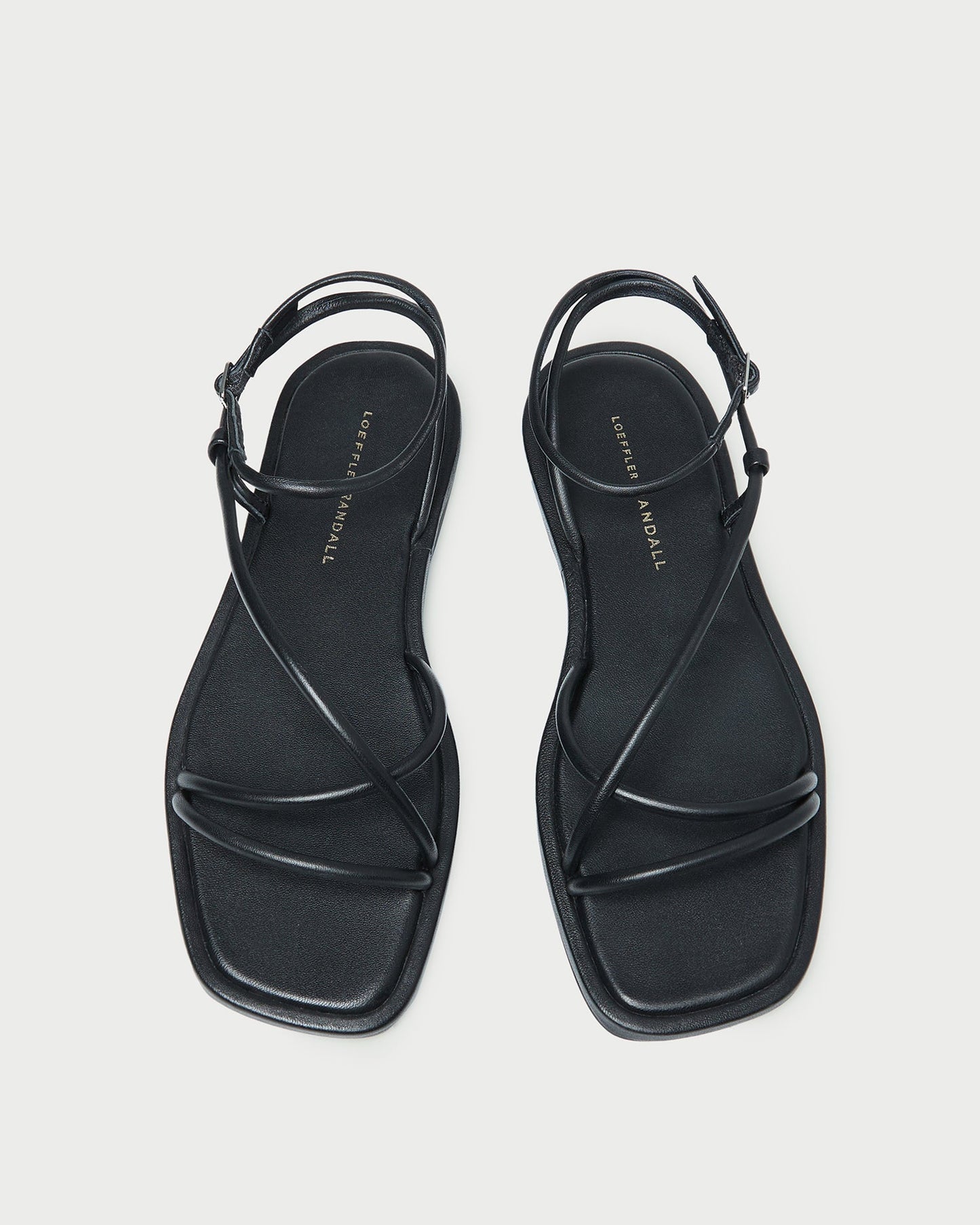 Sandale plate en cuir noir Noor