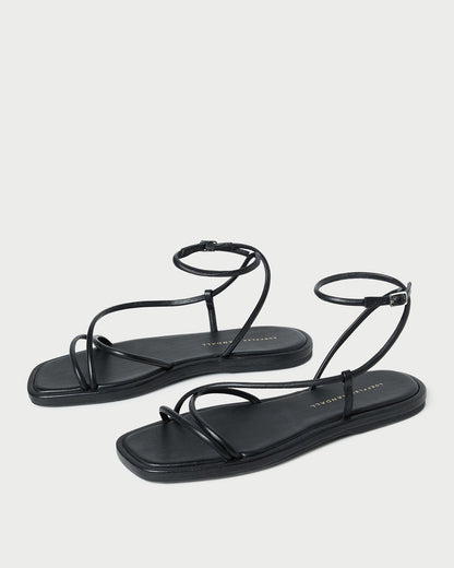 Sandale plate en cuir noir Noor